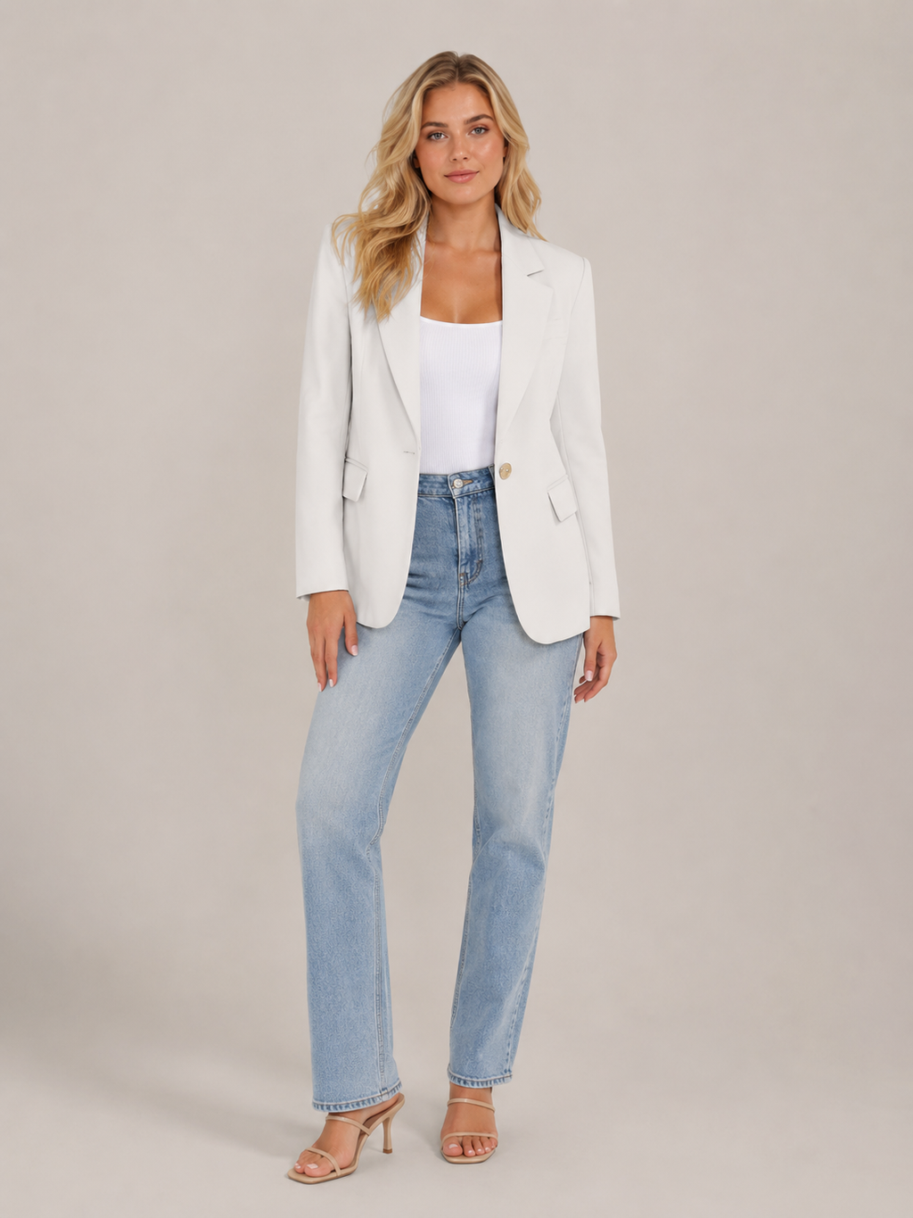 White fitted blazer with classic lapels, single-button front, flap pockets