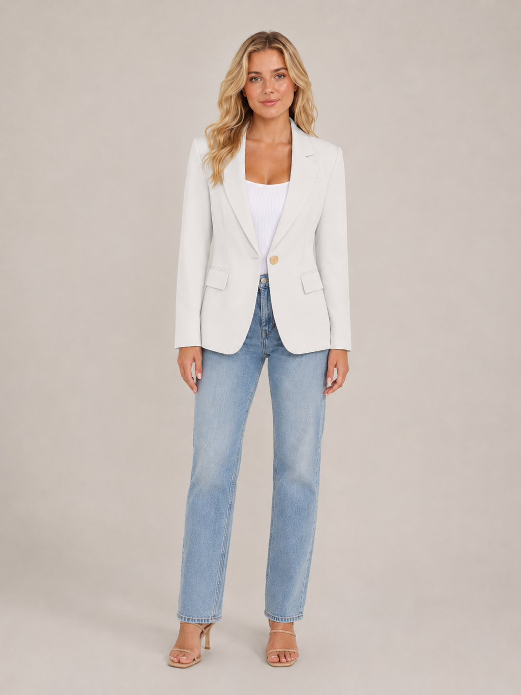 White fitted blazer with classic lapels and flap pockets, single-button front