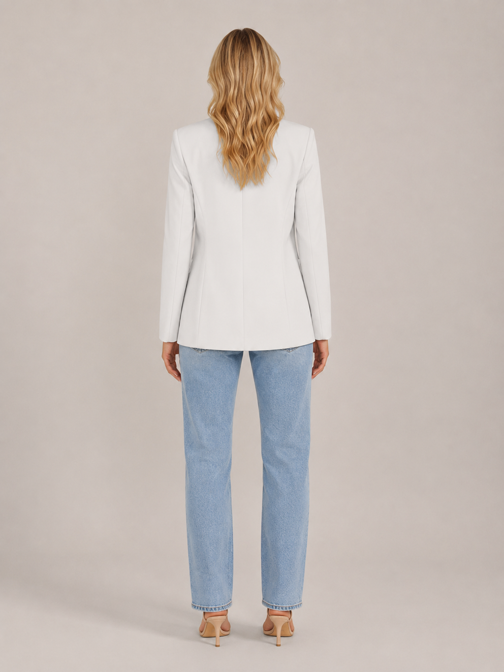 White fitted blazer back view with long sleeves and tailored seam detail