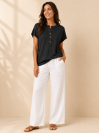 Black split-neck womens top with front button placket, short sleeves, loose fit