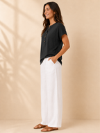 Black womens top with split neck and short sleeves, front button detail, loose fit