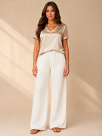 Champagne satin-look V-neck top, sheer dotted sleeves and relaxed fit