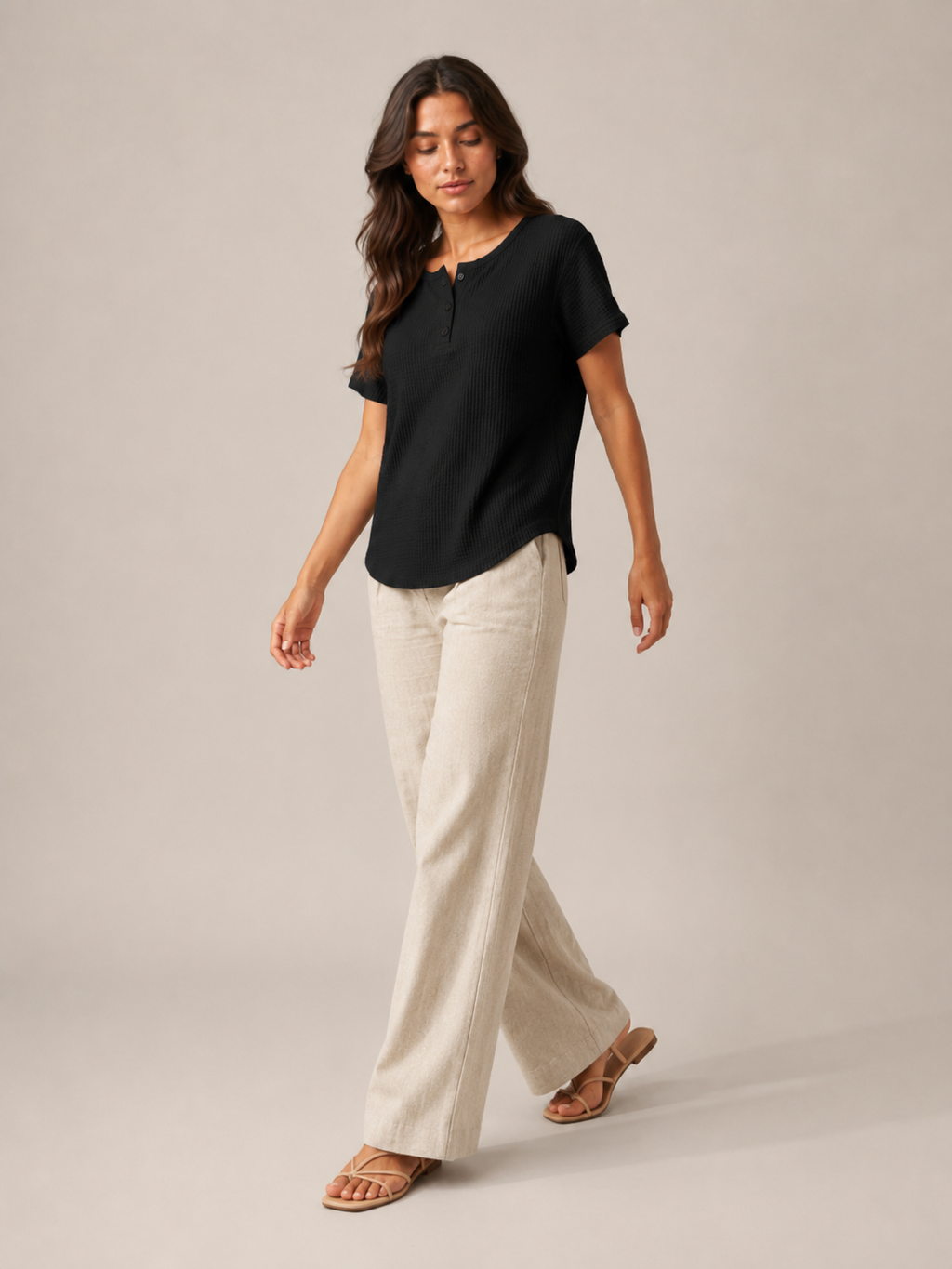 Women’s black short-sleeve button henley top with button placket and curved hemline