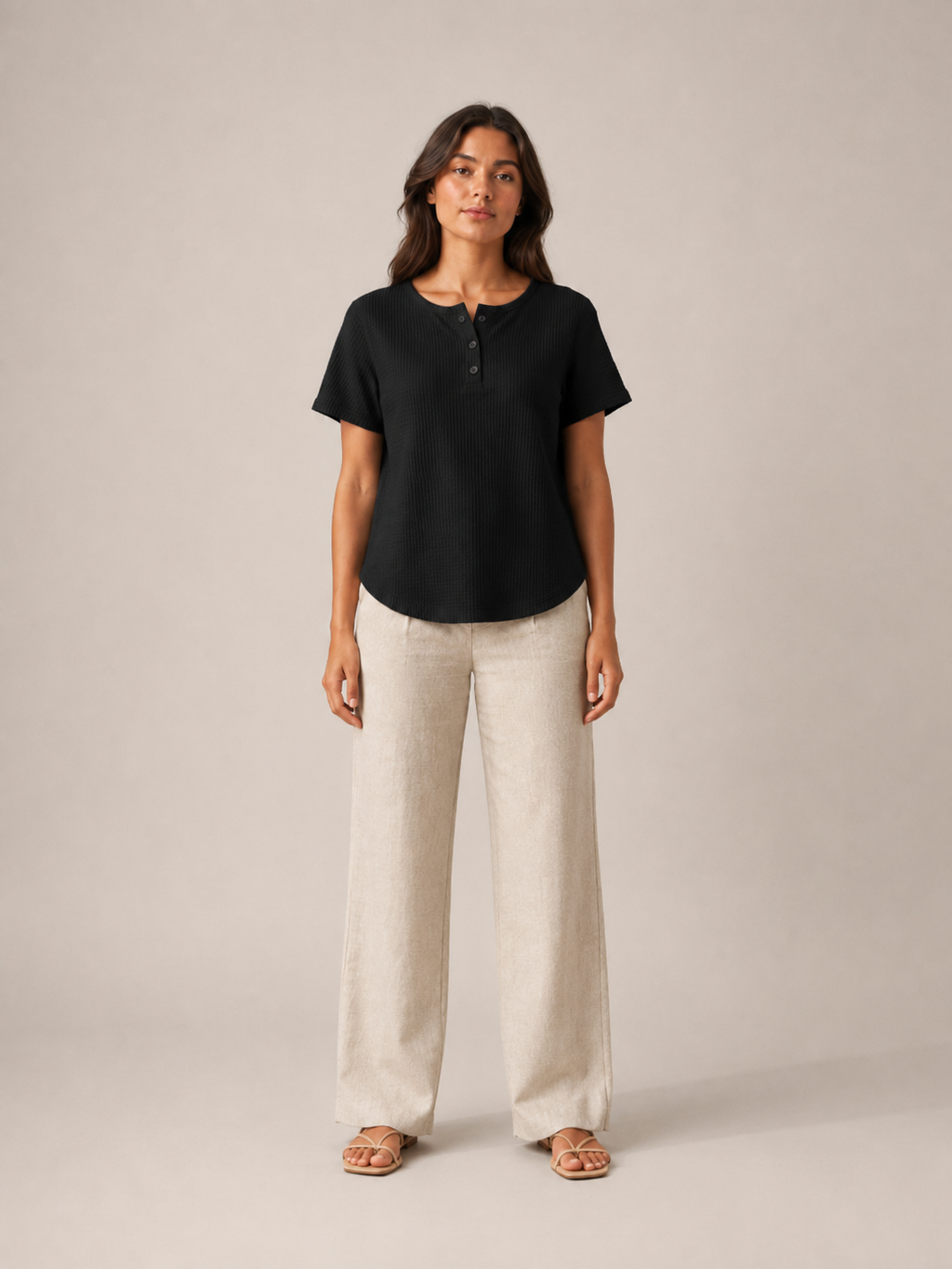 Women’s black short-sleeve button henley top shown front view with small button placket