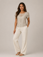 Soft khaki lace-neck flowing top with short puff sleeves and vertical lace panel