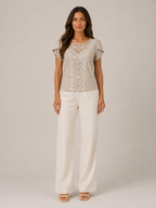 Soft khaki lace-neck flowing top with ornate vertical lace panel and short puff sleeves