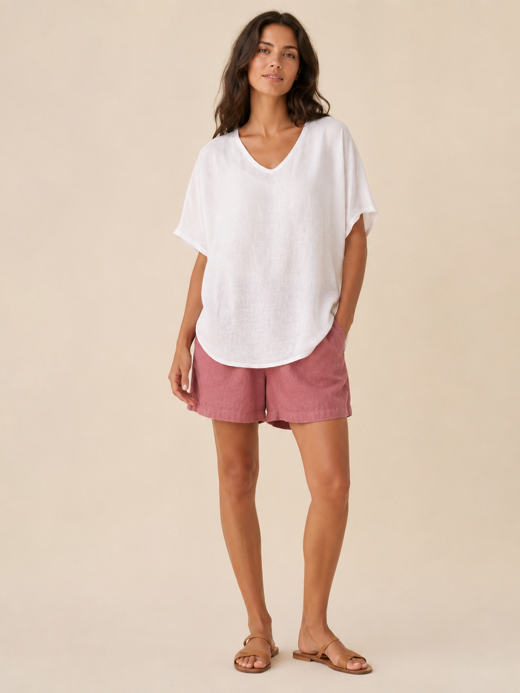 Women’s loose V-neck top in white, short wide sleeves for an airy drape.