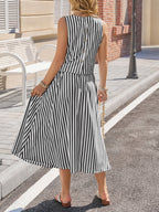 Black and white striped sleeveless midi dress with buttoned back and gathered skirt