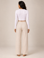 Lavender long-sleeve crop top with tiny floral print and low back
