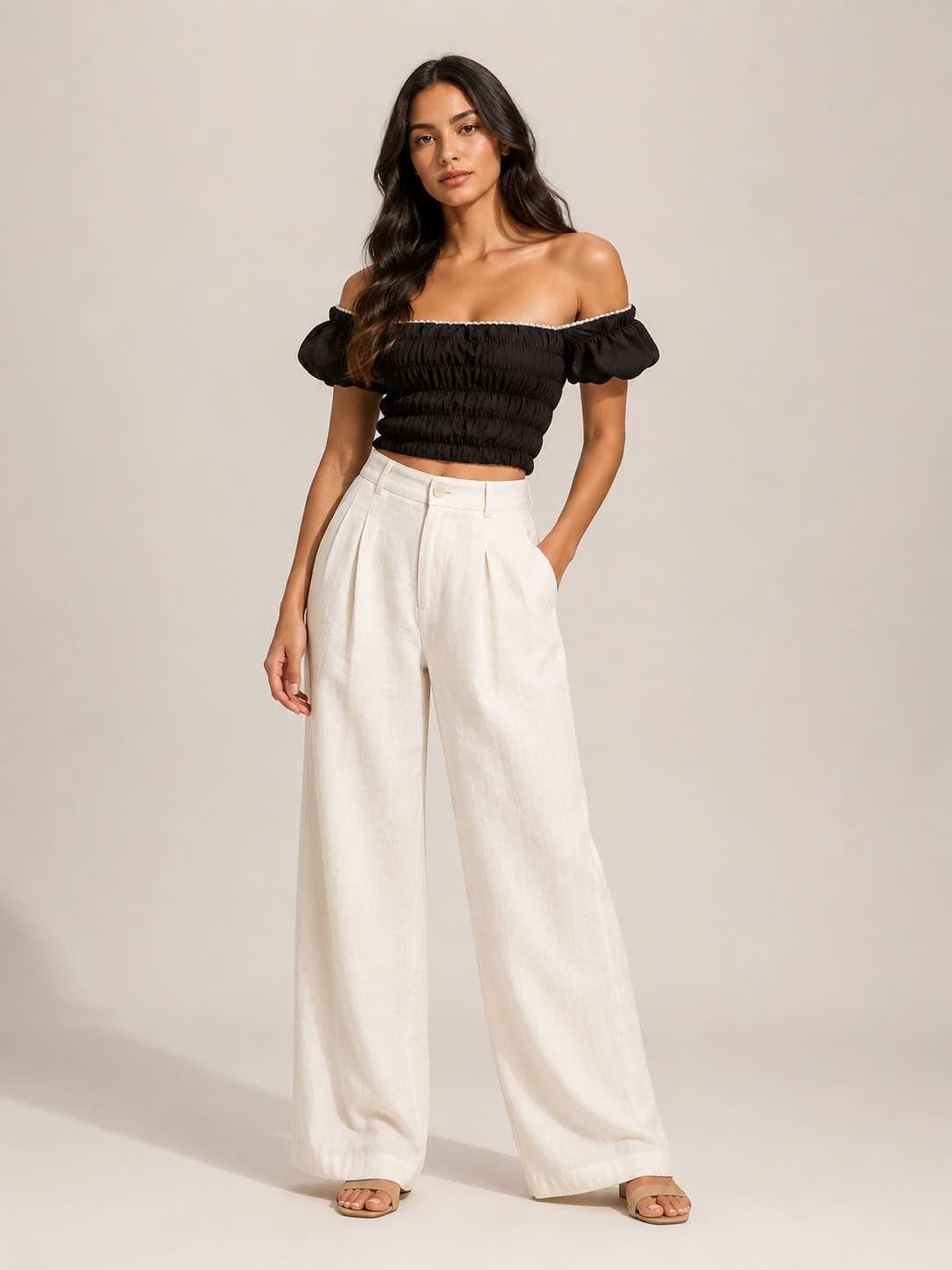 Black off-shoulder smocked top with ruffled puff sleeves, cropped with elastic neckline