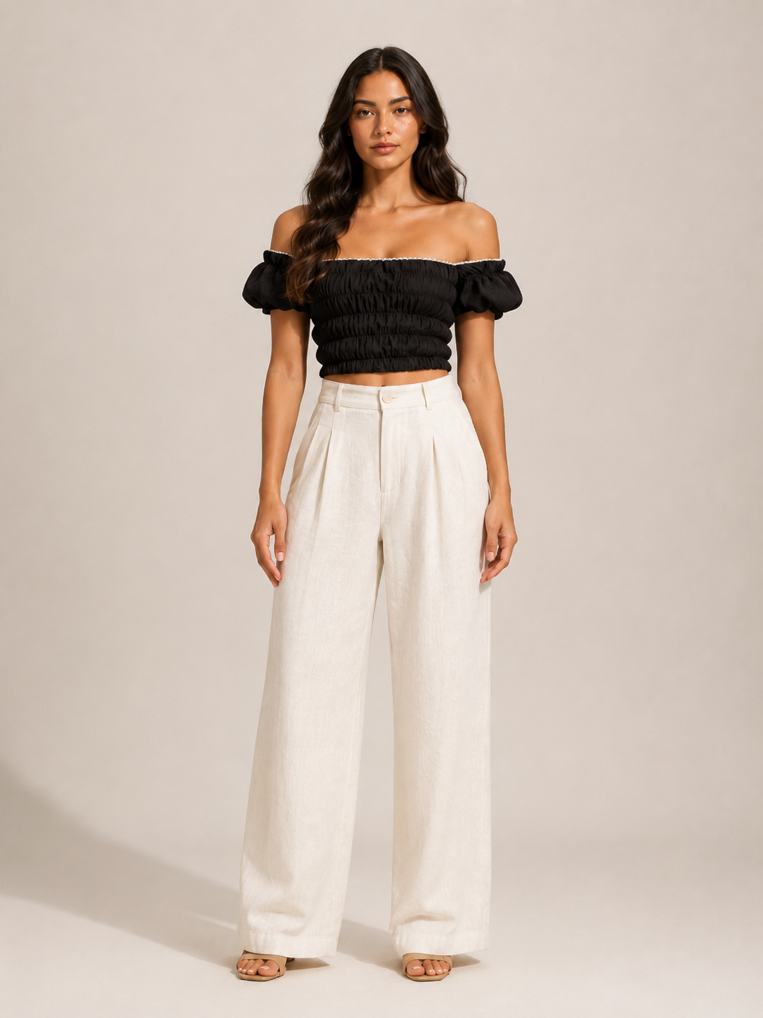 Black off-shoulder smocked top with puff sleeves, elastic bodice detail