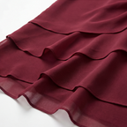 Burgundy layered ruffle fabric detail from a lined midi dress