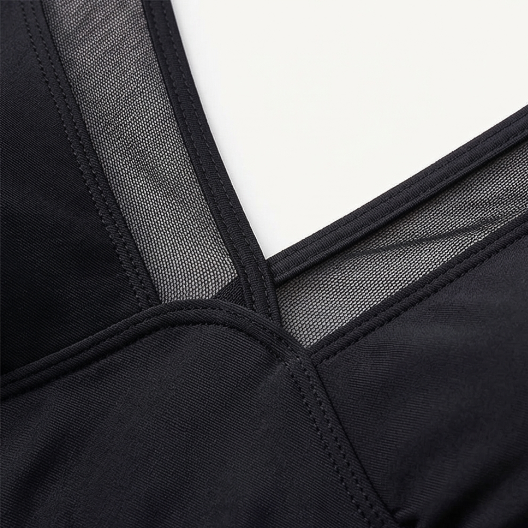 Black mesh swim top with V-shaped neckline and stitched seam details
