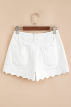 White denim shorts on hanger, high waist, scalloped hem, front patch pockets