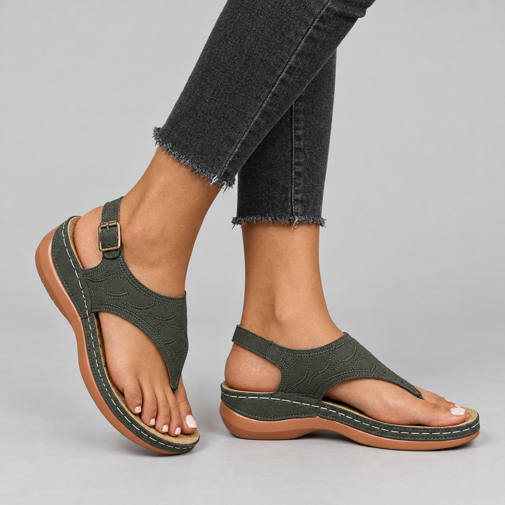 Olive green thong sandals worn with grey jeans, buckle back strap and wedge sole