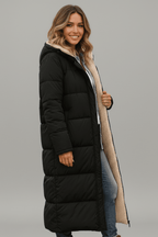 Black long puffer coat with hood, plush lining, and side zip detail