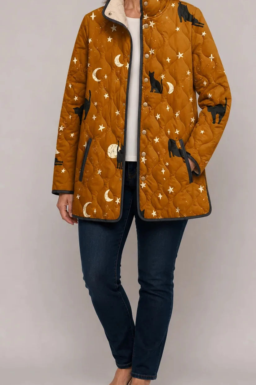 Wearbella mustard quilted jacket with black cats, moons, and stars print.
