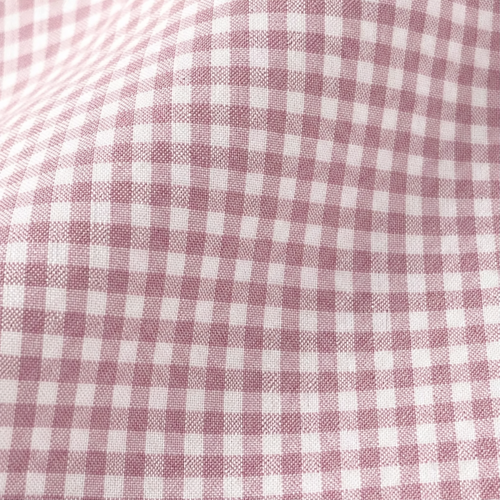 Close-up of pink and white gingham fabric pattern