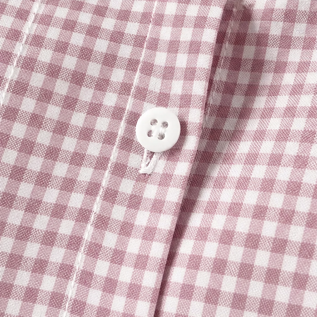 Pink gingham button placket with white front button
