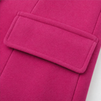 Wearbella coat detail showing a wide fuchsia sleeve tab and textured fabric
