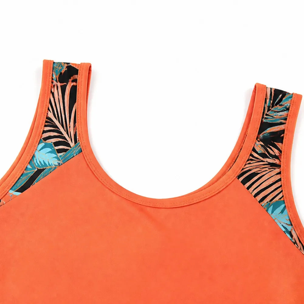 Coral tankini top neckline with tropical print side panels