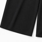 Black wide-leg shirt jumpsuit leg with straight drape and clean hem