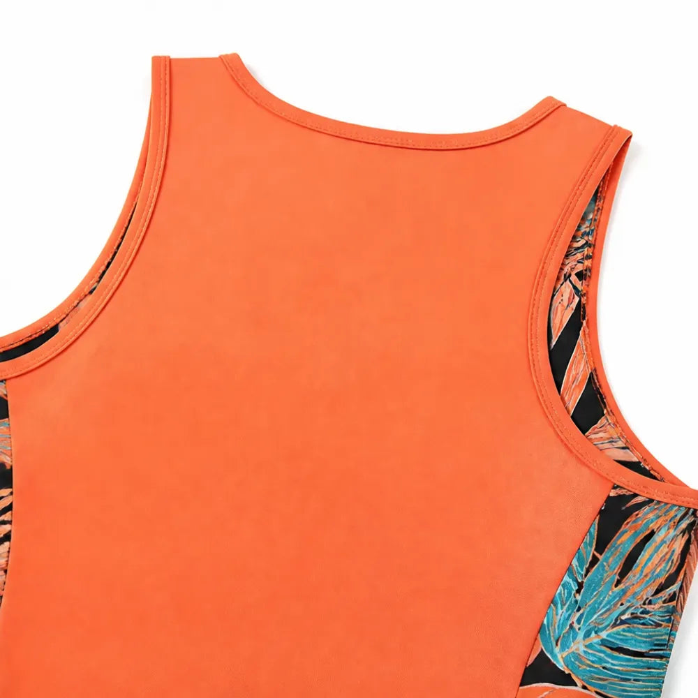 Coral tankini top with scoop neck and tropical print side panels