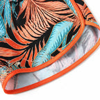 Tropical leaf swim shorts with orange-trimmed hem