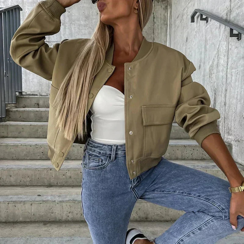 Women’s bomber jacket in olive green, button front with chest flap pocket and ribbed cuffs.