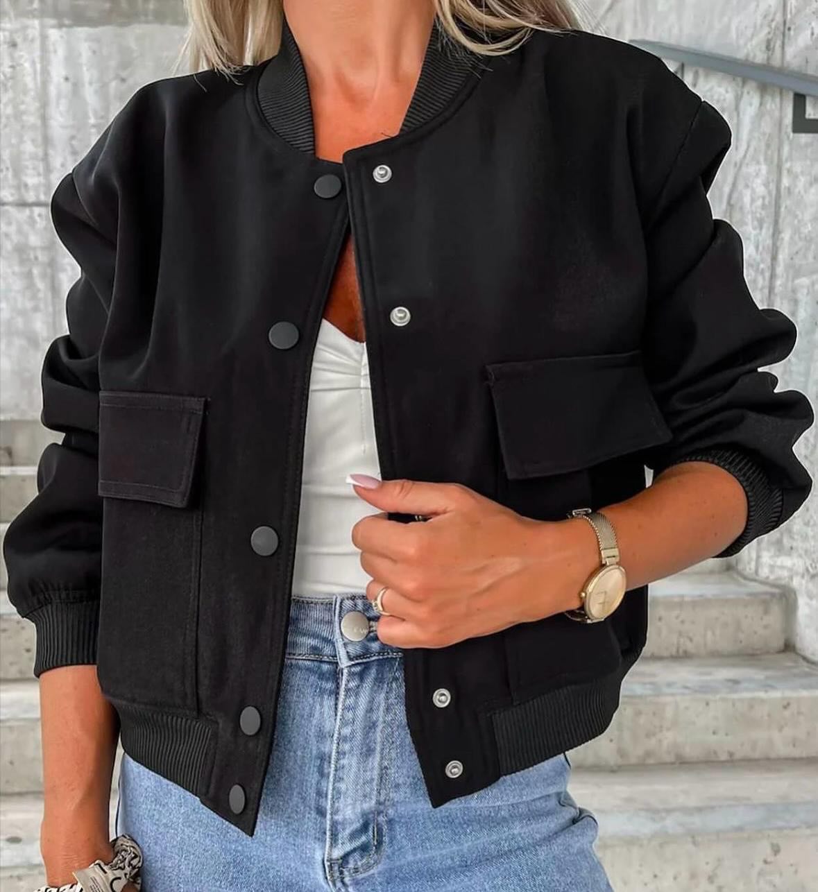 Women’s black bomber jacket, button front, chest flap pockets, ribbed cuffs.