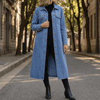 Blue denim coat shown from the front, with long sleeves, chest pockets, and a button closure