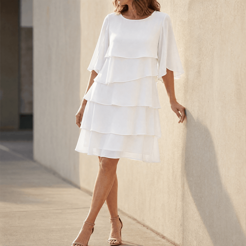 White tiered ruffle midi dress with layered skirt and elbow-length sleeves
