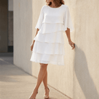 White tiered ruffle midi dress with layered skirt and elbow-length sleeves