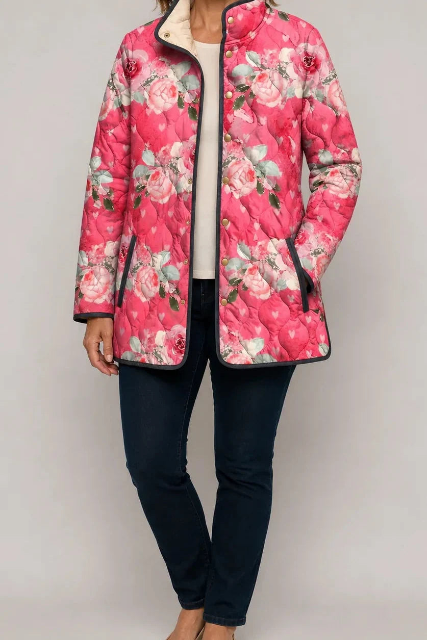 Wearbella pink floral quilted jacket with stand collar, snap front, and zip pockets.