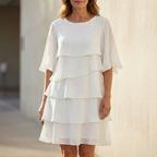 White tiered ruffle midi dress with three-layer skirt and elbow-length sleeves