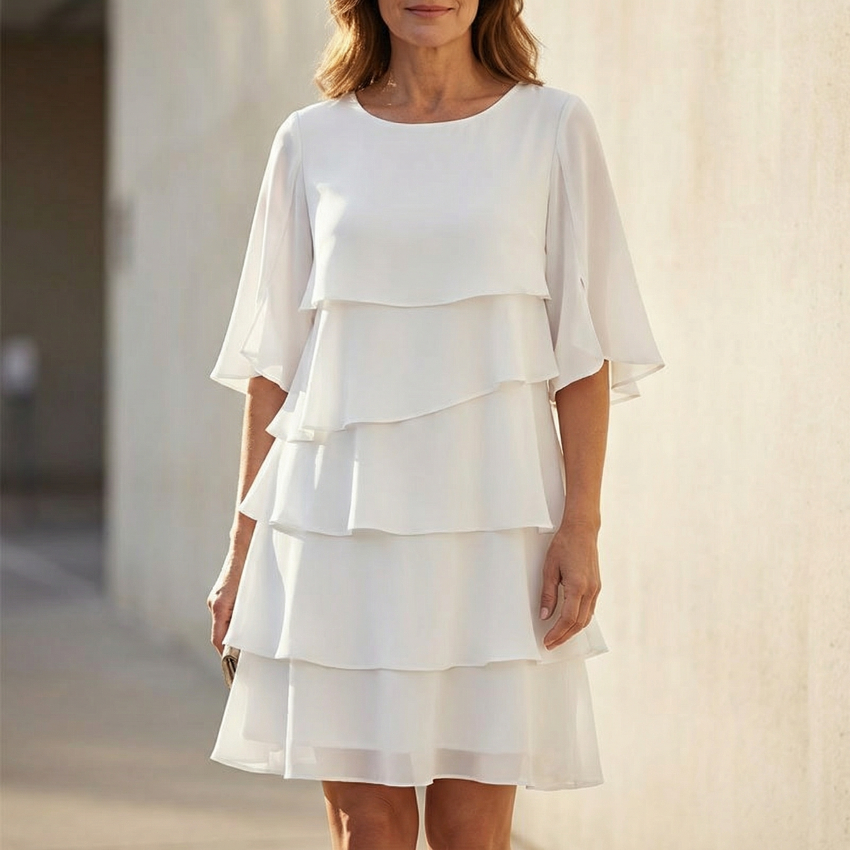 White tiered ruffle midi dress with three-layer skirt and elbow-length sleeves