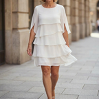 White tiered ruffle midi dress with layered skirt and flowy quarter sleeves