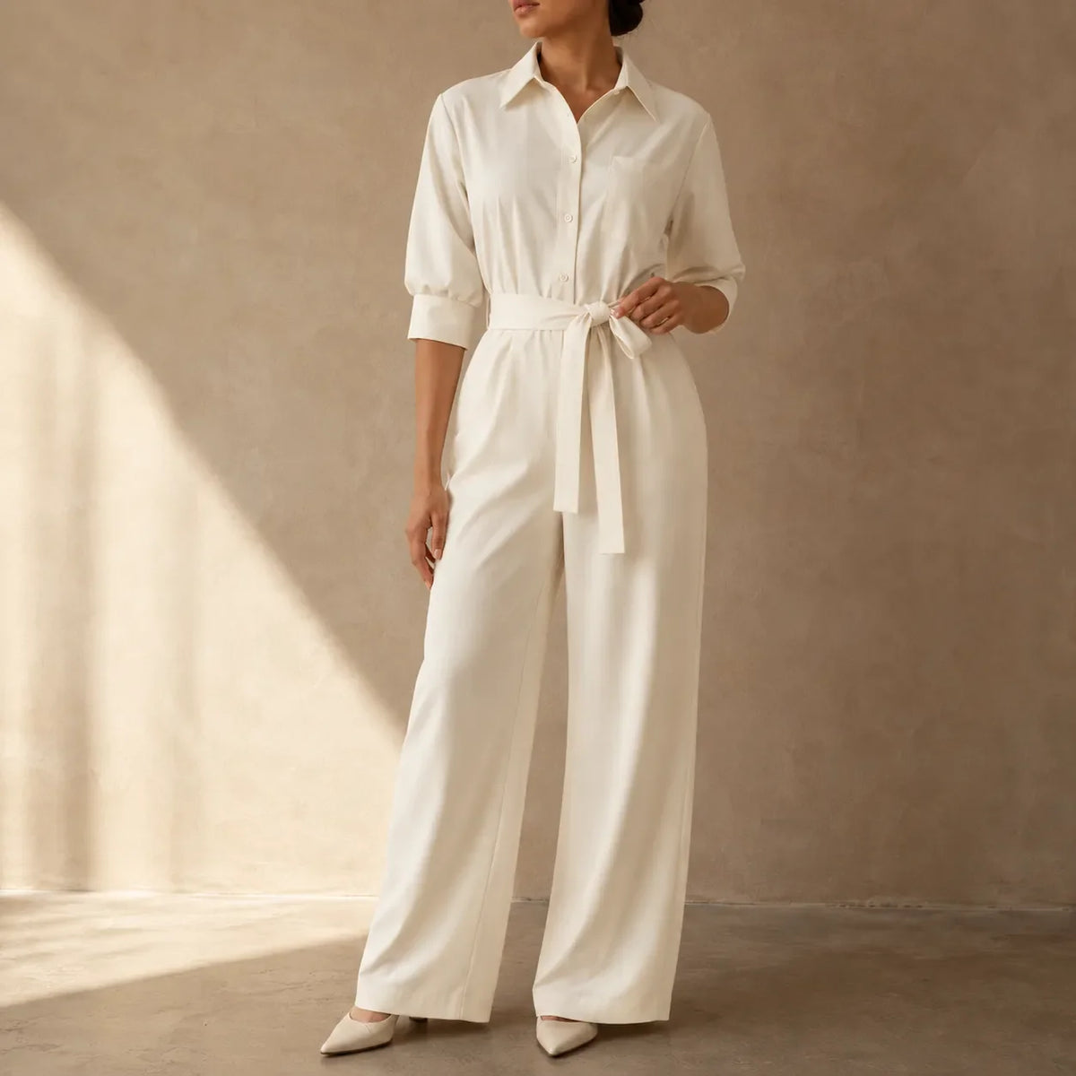 Ivory belted wide-leg shirt jumpsuit with tie waist and button-front shirt collar
