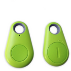 Mini GPS tracker for kids, lime green key-fob with circular button and ring hole
