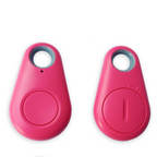 Mini GPS tracker for kids, pink key-fob with circular button and ring hole