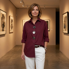 Burgundy women's blouse with oversized silver statement buttons and pointed collar