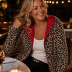 Reversible coat worn leopard-print side out with red hood lining