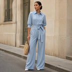 Chambray blue belted wide-leg shirt jumpsuit with tie waist and rolled sleeves
