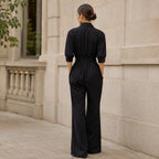 Black belted wide-leg shirt jumpsuit with back gathers and tie waist detail