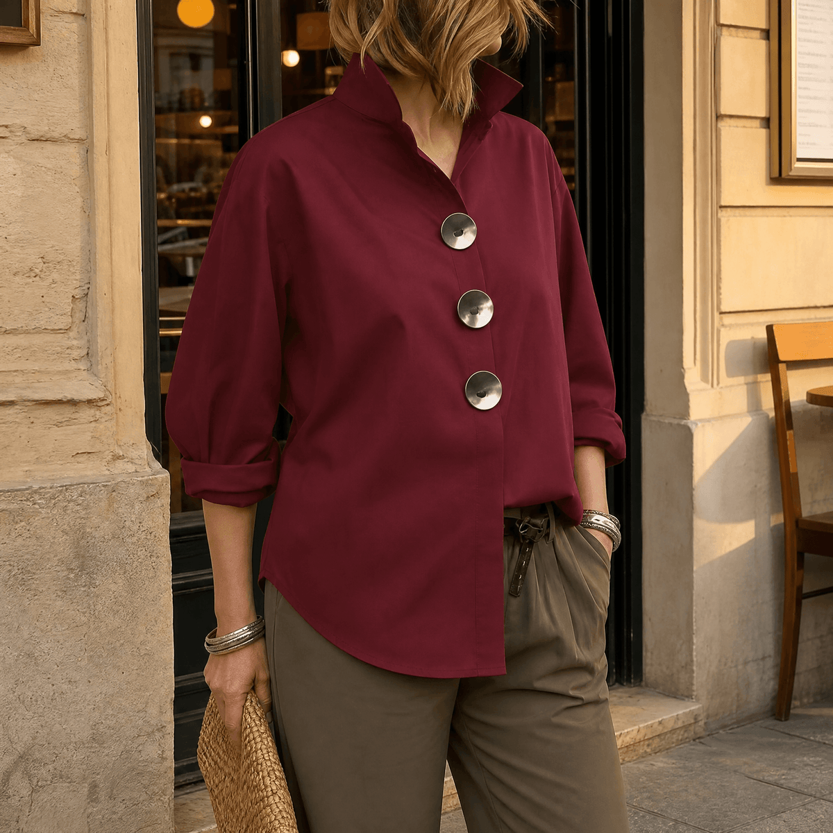 Women's burgundy asymmetric button-up blouse with oversized silver front buttons