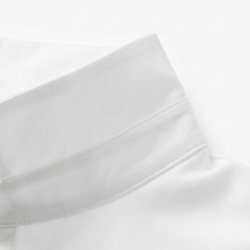 White blouse sleeve cuff and collar with stitched placket details