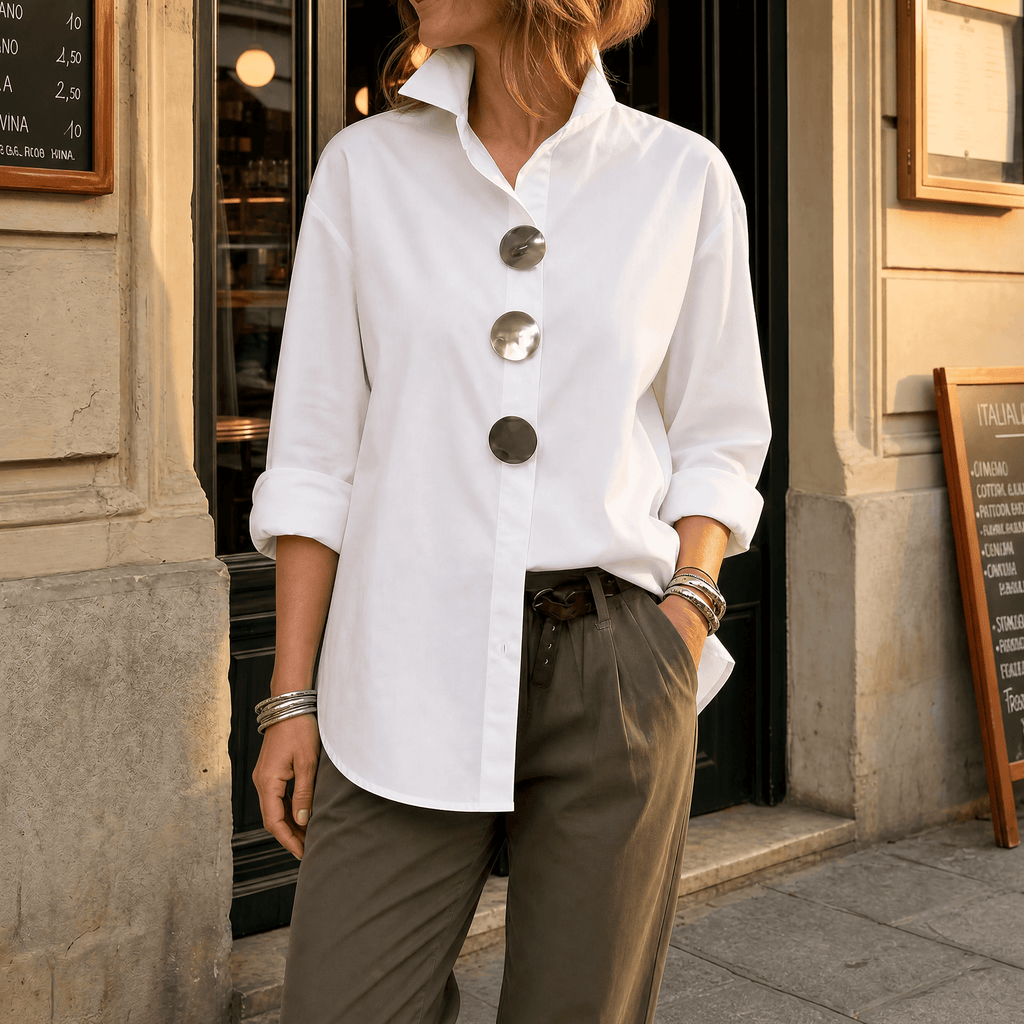 White women's button-up blouse with oversized silver statement buttons and collar