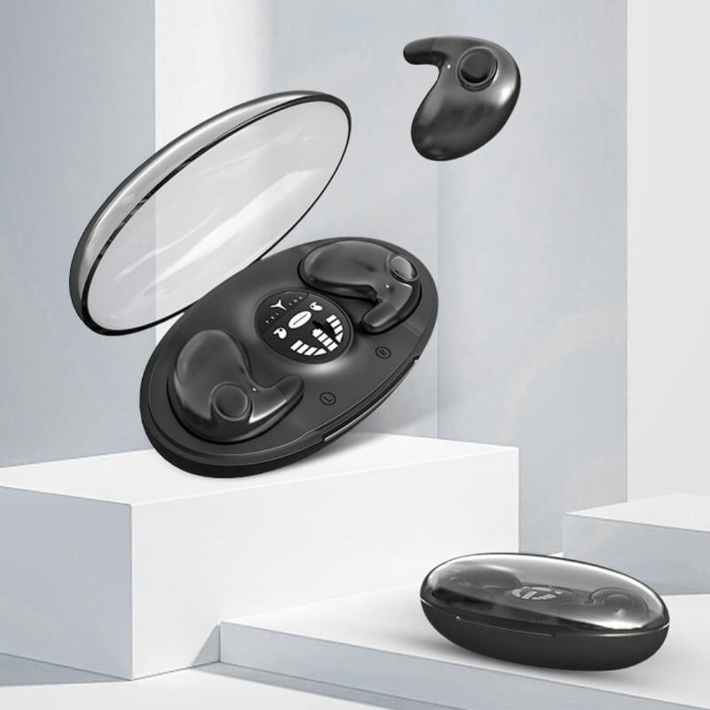 Black wireless sleep earbuds in open charging case, compact earbuds and tips