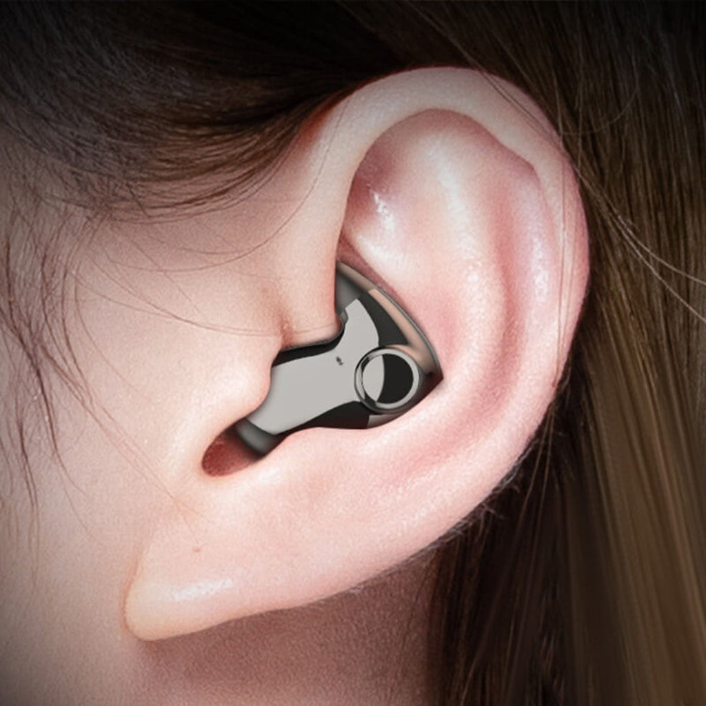 Compact wireless sleep earbud fitted in ear, low-profile ergonomic tip