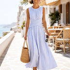 Blue striped sleeveless maxi dress with wrap waist detail and flowing long skirt